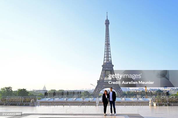 Paris City Mayor Anne Hidalgo and Paris 2024 President Tony Estanguet pose in front of the Eiffel Tower as The Olympic Rings are displayed 50 days...
