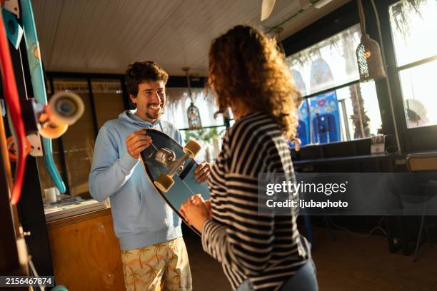 entrepreneurial spirit in a local board shop - skateboard shop stock pictures, royalty-free photos & images