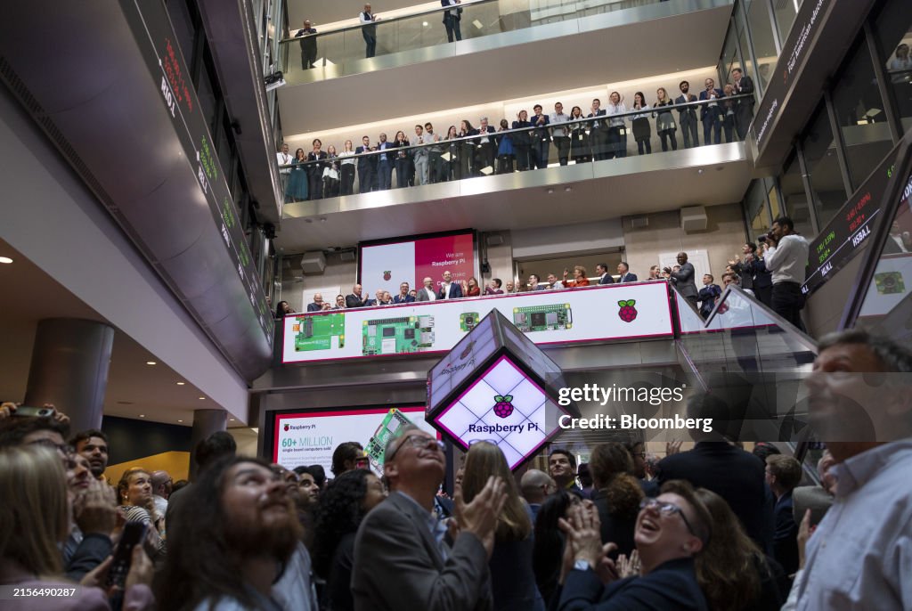 Raspberry Bell Attendees at the bell-ringing ceremony for the Raspberry Pi Ltd ...