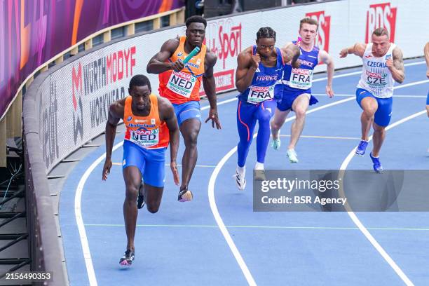 Elvis Afrifa of the Netherlands handing his baton over to Taymir Burnet of the Netherlands competing in the 4 x 100m Relay Men during Day Five of the...