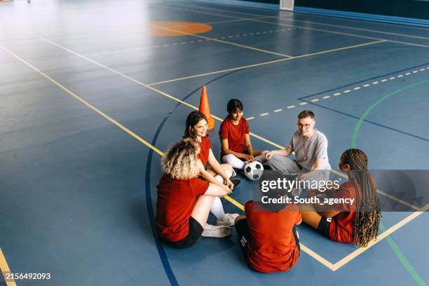 diverse teenage female soccer team having a practice - international team soccer stock pictures, royalty-free photos & images