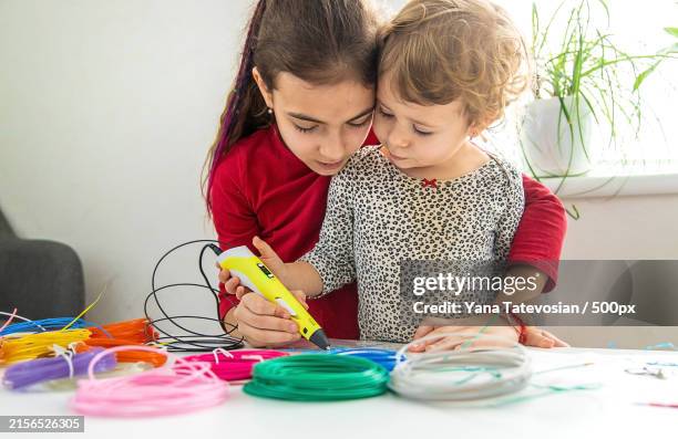 mother and daughter playing with toys at home - vinyl banner printing stock pictures, royalty-free photos & images