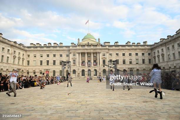 Models dancing on the runway at the Charles Jeffery Loverboy show during London Fashion Week June 2024 at Somerset House on June 07, 2024 in London,...