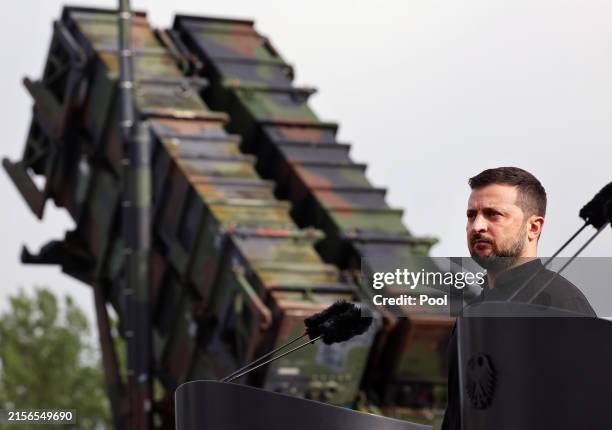 Volodymyr Zelensky, President of Ukraine, stands in front of a Patriot anti-aircraft missile system during his visit to a military training area on...