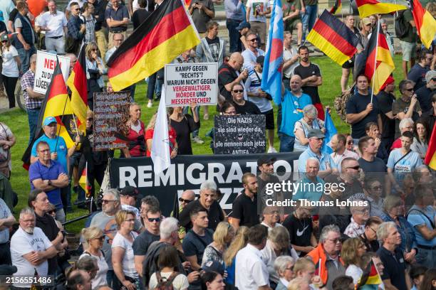 Supporters of the far-right Alternative for Germany party gather originally for a campaign event for the European elections a week after the murder...