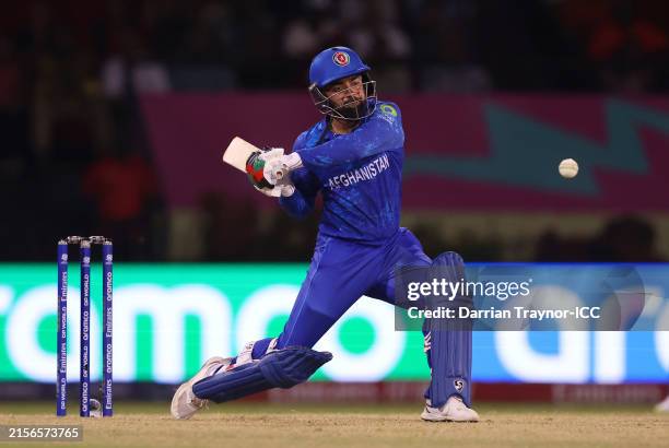 Rashid Khan of Afghanistan bats during the ICC Men's T20 Cricket World Cup West Indies & USA 2024 match between New Zealand and Afghanistan at...