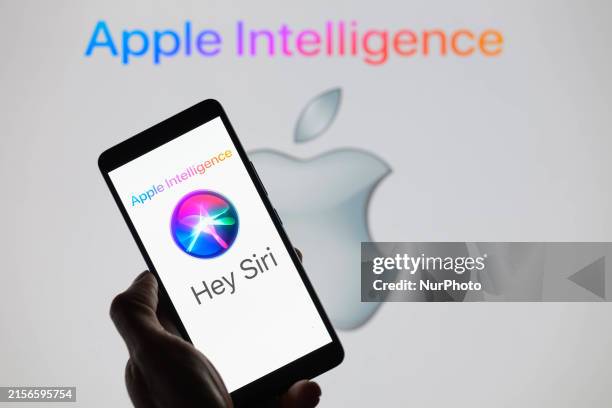 The Apple Siri AI icon is being displayed on a smartphone, with Apple Intelligence in the background, in this photo illustration in Brussels,...