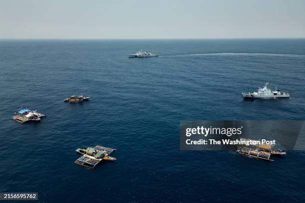 Chinese Coast Guard ship with hull number 4203 is seen closely shadowing the convoy of Filipino fishing boats and a Philippine Coast Guard ship, on...