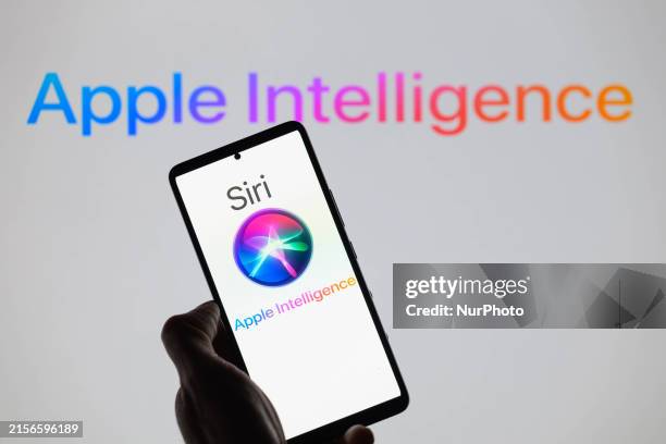 The Apple Siri AI icon is being displayed on a smartphone, with Apple Intelligence in the background, in this photo illustration in Brussels,...
