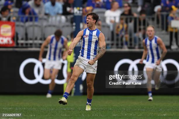 Jy Simpkin of the Kangaroos celebrates a goal during the round 13 AFL match between West Coast Eagles and North Melbourne Kangaroos at Optus Stadium,...