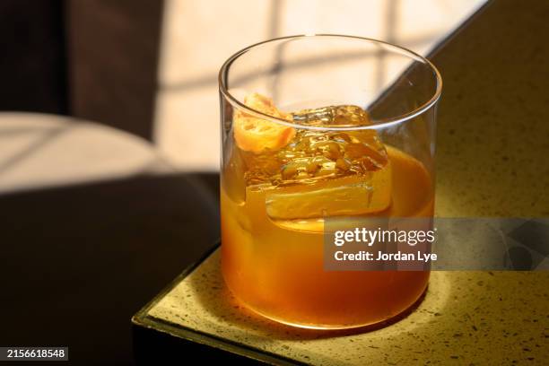 negroni cocktail on a table top - tequila drink stock pictures, royalty-free photos & images