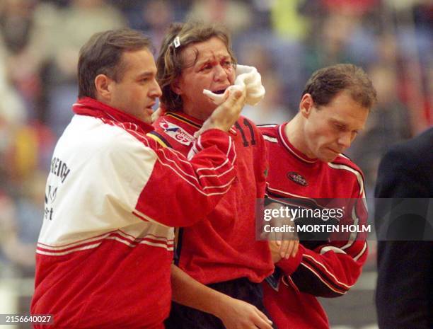 Ausra Fridrikas of Austria leaves the field after being injured in a collision with Norwegian Kristine Duvholt in the semi-final of the women's...