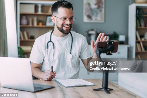 doctor making online live streaming broadcast. - monopod bildbanksfoton och bilder