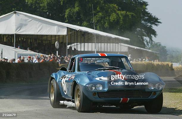 Richard Attwood in action in a 1963 Chevrolet Corvette Grand Sport during the Goodwood Festival of Speed at Goodwood House on July 12, 2003 in...