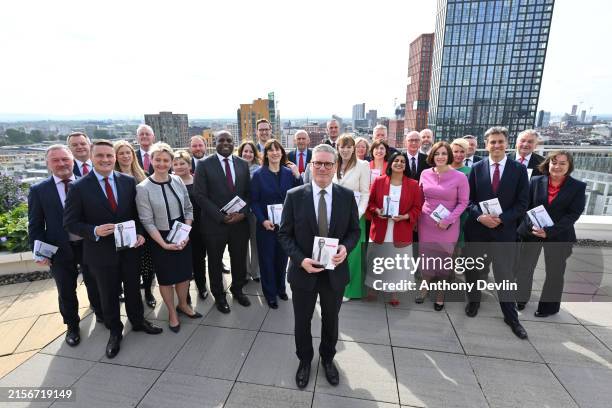 Labour Party leader Sir Keir Starmer poses with his shadow cabinet as Labour launch their general election manifesto on June 13, 2024 in Manchester,...