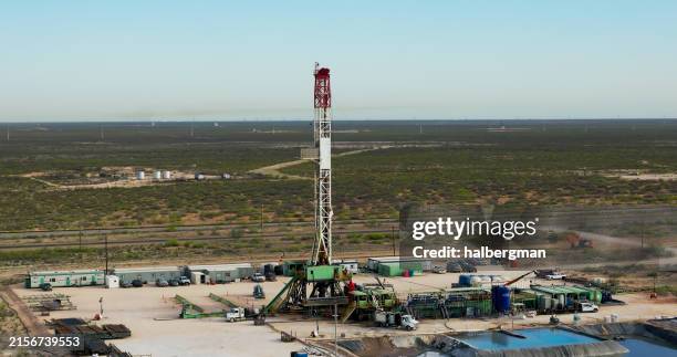 drone view of a gas well in texas on sunny day - oil drill stock pictures, royalty-free photos & images