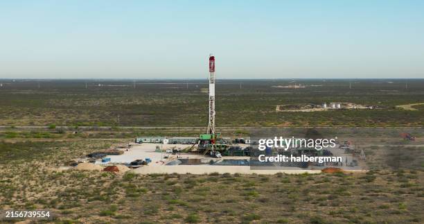 aerial shot of a gas well in texas on sunny day - oil drill stock pictures, royalty-free photos & images