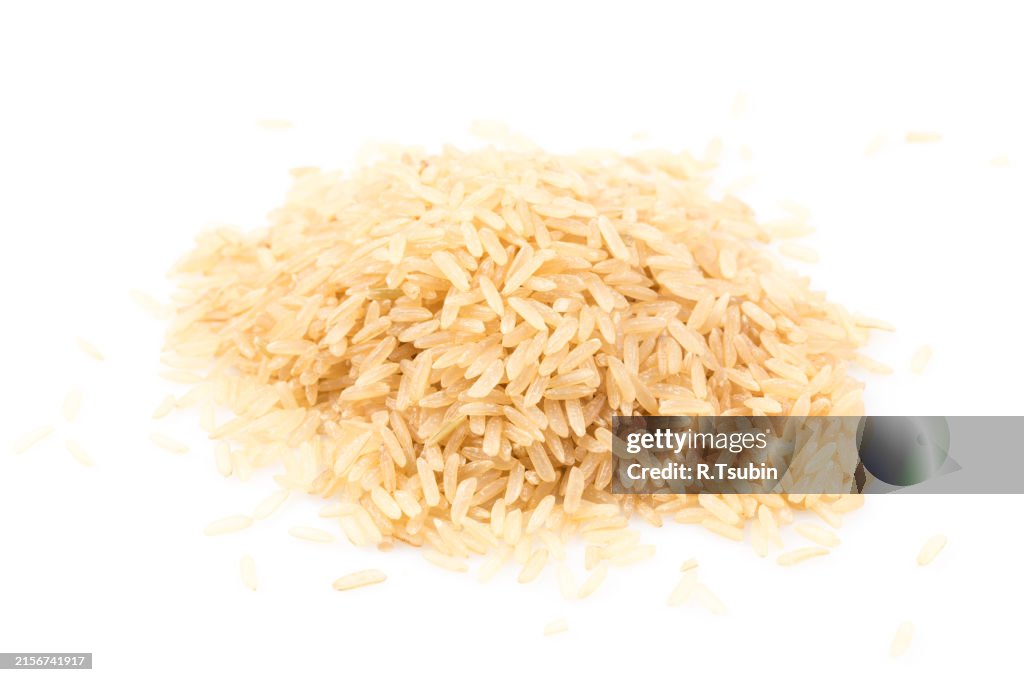 Ploth Rice Pile Of Brown Rice Isolated On A White Background High-Res Stock Photo ...
