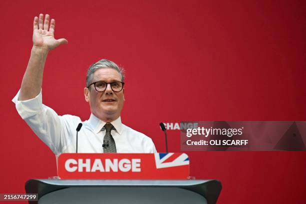 Britain's main opposition Labour Party leader Keir Starmer delivers a speech on stage during the launching of Labour Party election manifesto, in...