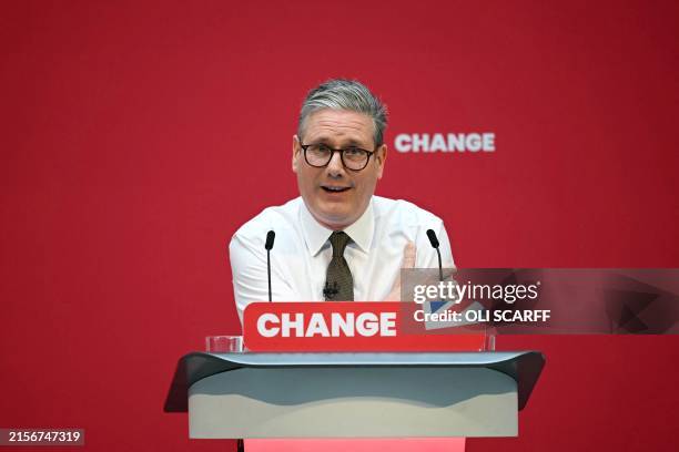 Britain's main opposition Labour Party leader Keir Starmer delivers a speech on stage during the launching of Labour Party election manifesto, in...