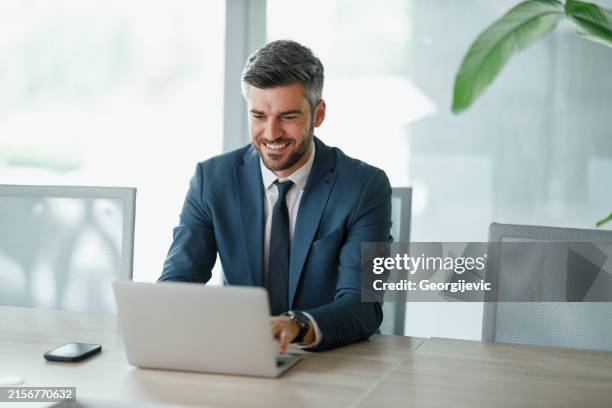 working on a laptop - businessman stock pictures, royalty-free photos & images