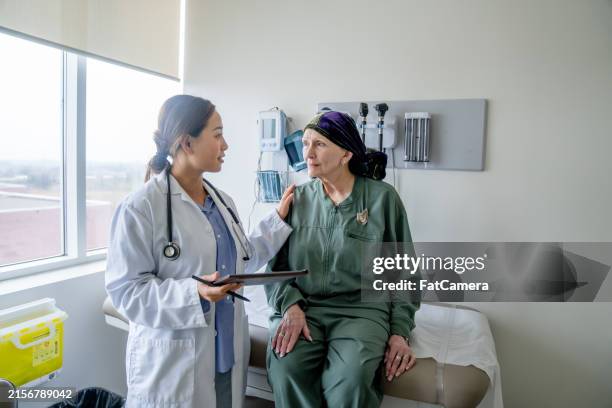 senior oncology appointment - oncologist stock pictures, royalty-free photos & images