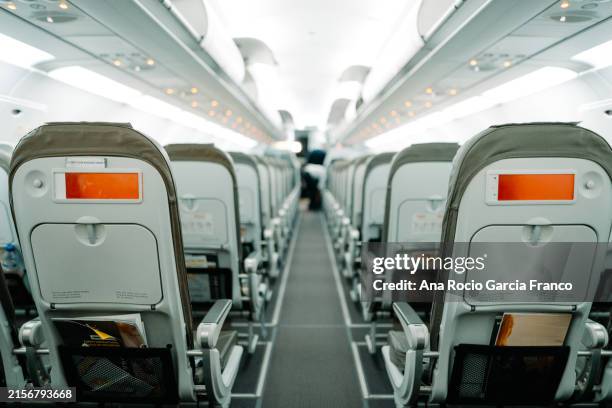 seats in aircraft cabin - flugzeugsitz stock-fotos und bilder