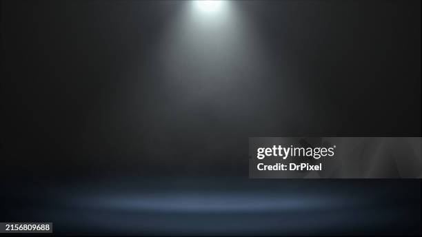 spotlight illuminating the stage - spotlit stock pictures, royalty-free photos & images