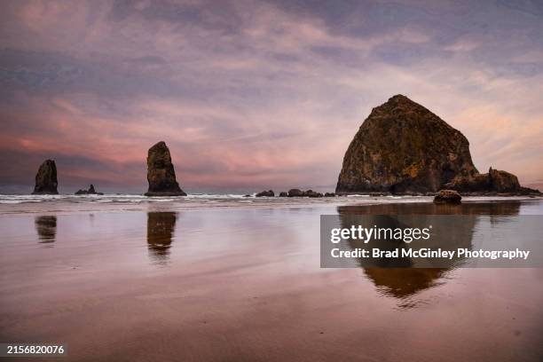 haystack rock sunset - haystack rock stock pictures, royalty-free photos & images
