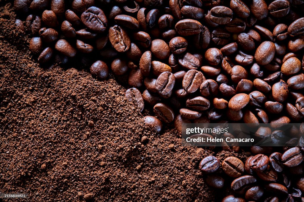 Top of view of toasted coffee beans and ground coffee as a background