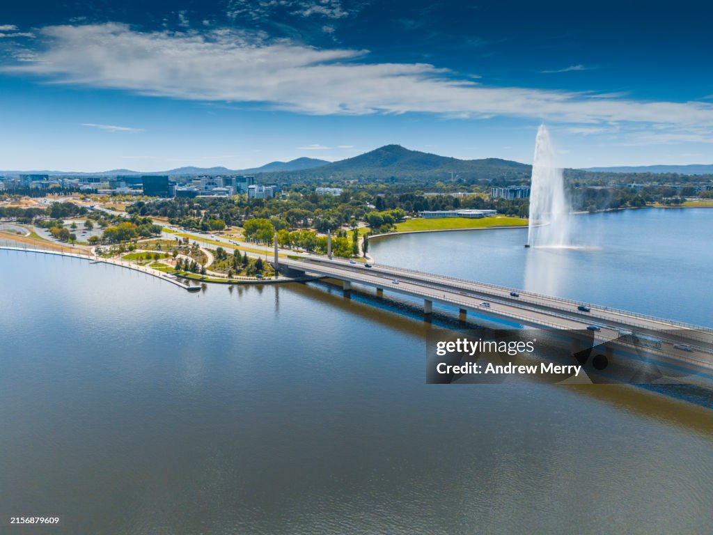 Idyllic city with bridge lake and fountain Canberra
