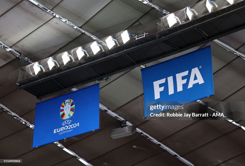 Exploding Flags Euros Football Detailed view of the FIFA logo and Euro 2024 logo on flags ahead of ...