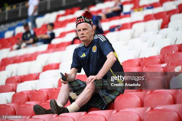 Fans arrive at the Munich Football Arena ahead of the opening match of 2024 European Football Championship Group A football match between Germany and...