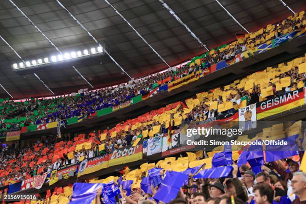 Multi coloured squares are held up prior to kick off during the UEFA EURO 2024 group stage match between Germany and Scotland at Munich Football...