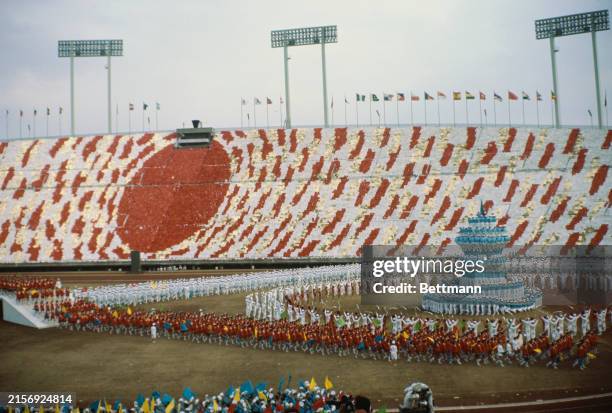 Kaleidoscopic effects being created by gymnasts performing at a Soka Gakkai Buddhist festival at the National Stadium in Tokyo, Japan, October 1967....