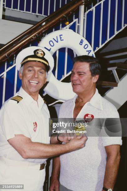 American actors Gavin MacLeod and Bert Parks promoting the latter's guest appearance in the series 'The Love Boat' at the studios of 20th Century Fox...