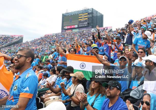 Fans of India celebrate a score against Pakistan at the World Cup at the cricket stadium at Eisenhower Park in East Meadow, New York on June. 9, 2024.