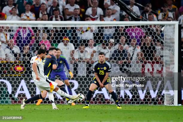 Emre Can of Germany shooting to goal during the UEFA EURO 2024 group stage match between Germany and Scotland at Munich Football Arena on June 14,...
