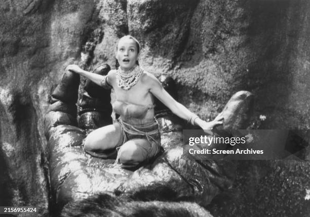 Jessica Lange sits in giant ape hand in a scene from the 1976 film version of 'King Kong'.
