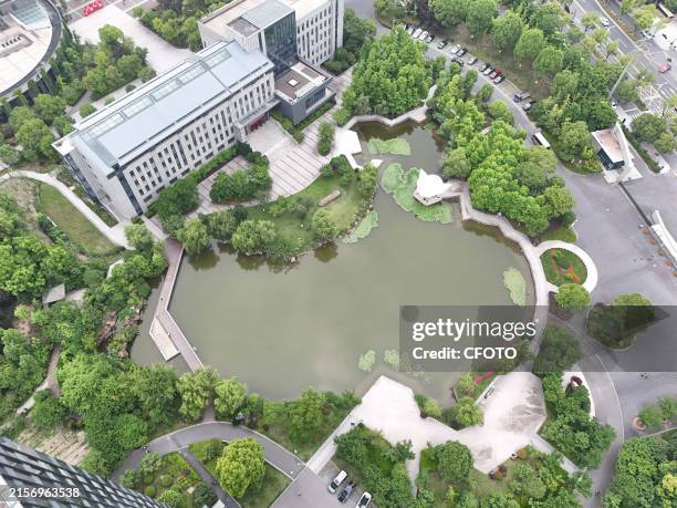 Lake shaped like a map of China is seen at a university in Hangzhou, Zhejiang province, China, June 14, 2024.