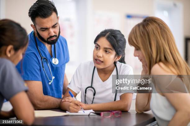 medical team meeting - medicare stock pictures, royalty-free photos & images