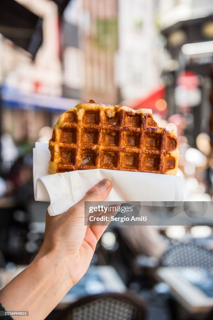 Holding a Belgian waffle