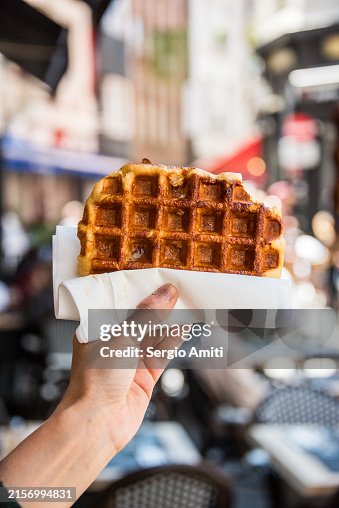 Holding a Belgian waffle Holding a Belgian waffle