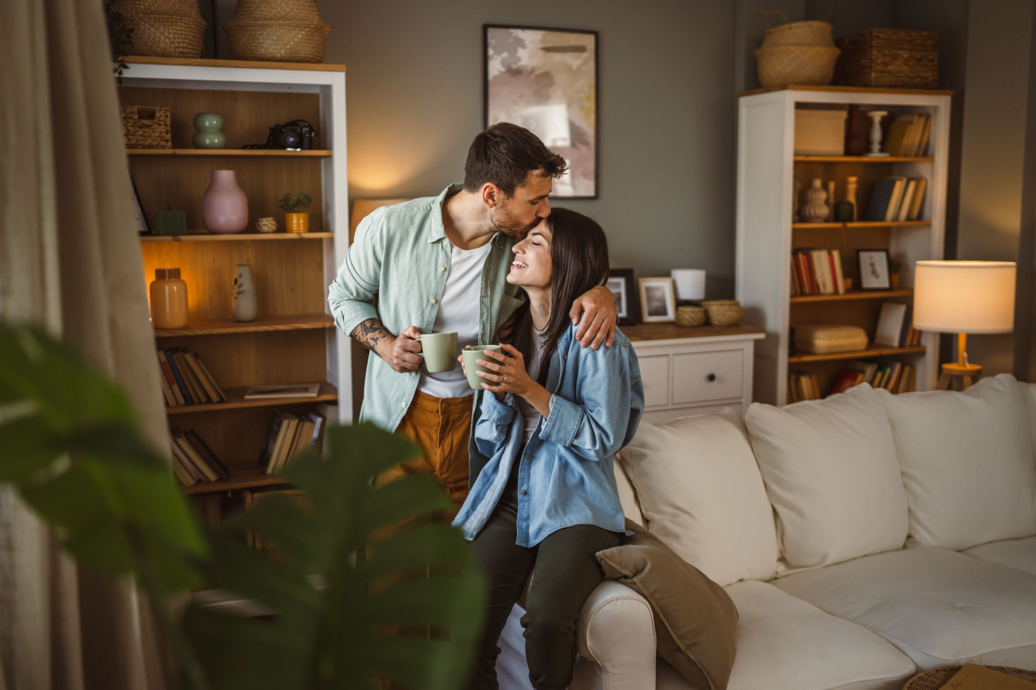 Boyfriend and girlfriend drink coffee and enjoy at home Boyfriend and girlfriend drink coffee and enjoy at home