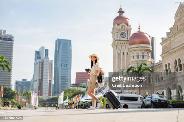 tourist wandering around kuala lumpur - malaysia travel stock pictures, royalty-free photos & images