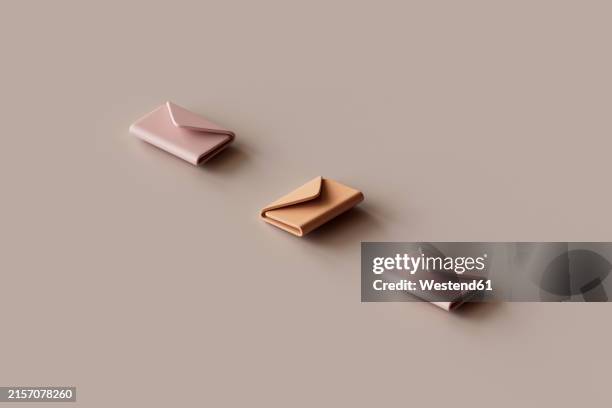 3d render of threee-mail icons lying against brown background - brown background stock illustrations