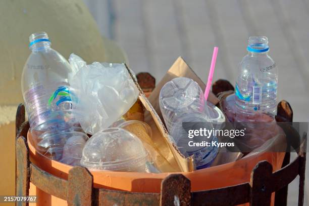 plastic water bottles thrown away in trash can - wastepaper bin stock pictures, royalty-free photos & images