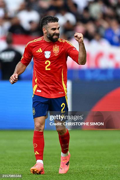 Spain's defender Dani Carvajal celebrates after scoring his team's third goal during the UEFA Euro 2024 Group B football match between Spain and...