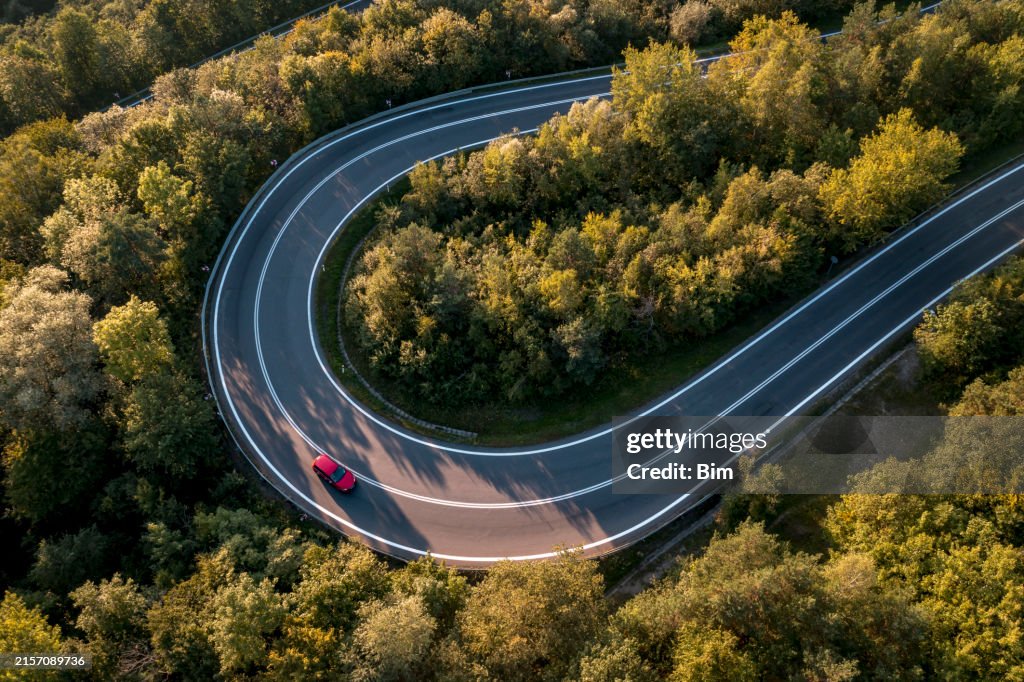 Red car on a winding road