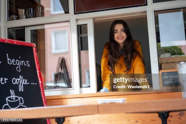 smiling owner standing at cafe window - drive through stock pictures, royalty-free photos & images